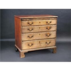 A George III mahogany chest, the moulded rectangular top above a brushing slide and four long gradu.