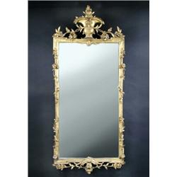 A late 18th/early 19th century carved wood gilt and gesso wall mirror, the rectangular plate within.