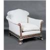 Image 1 : A mahogany framed library chair, possibly Irish, the arched padded back above padded arms, cushion..