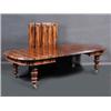 Image 1 : A coromandel and mahogany extending dining table, the moulded rounded rectangular top incorporating.