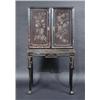 Image 1 : A Chinoiserie decorated lacquered cabinet on stand, the upper section with a pair of panelled doors.