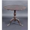 Image 1 : A 19th century stained beech tripod table, the circular tilt top with pie crust edge supported on a.