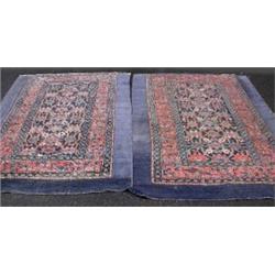 A pair of Kurdish Blue Carpets, 19th century, the indigo geometric field with madder triple borders,