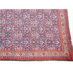 A Mahal Feraghan Carpet, West Persia, 19th century, the indigo field with an allover stylised flora.