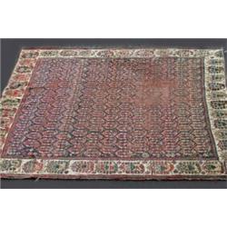 A Khamseh Carpet, 19th century, the allover boteh central design within an ivory border containing..