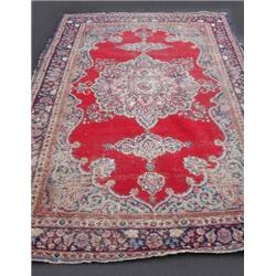 A Tabriz carpet, North West Persia, 19th century, the wine red central field with triple ivory and..