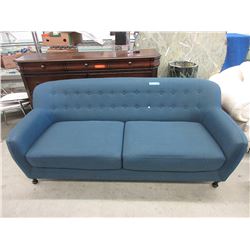 Blue upholstered sofa