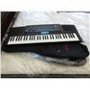 Image 1 : Used Casio keyboard and 2 new guitar cases
