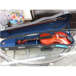 Child sized violin with bow in case