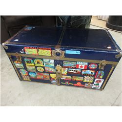 Vintage metal trunk with travel stickers
