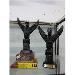 Pair of Neil statues with commemorative plaques