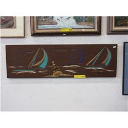 Carved wall plaque of sailing ships