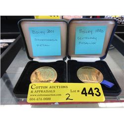 2 Bisley metals in presentation cases