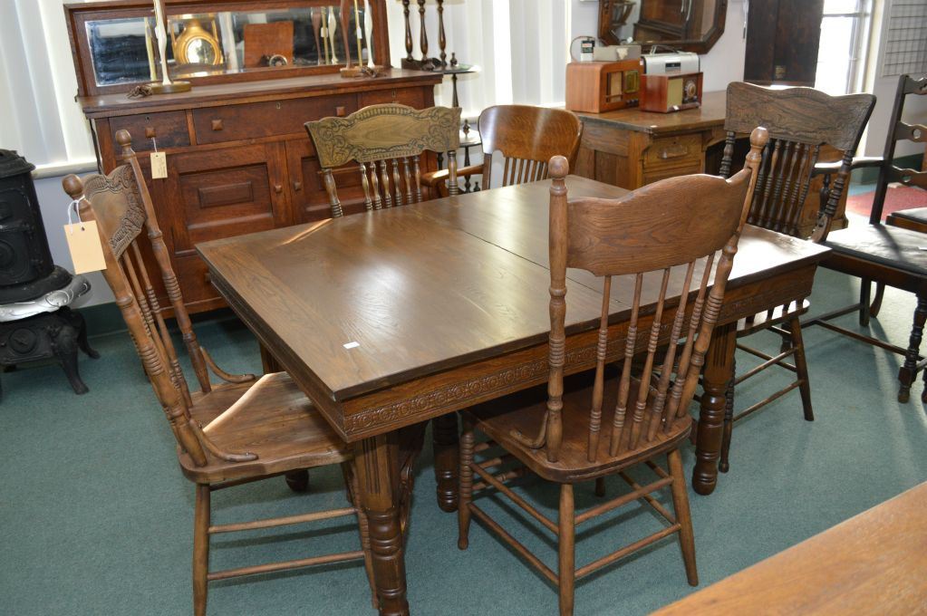 Antique Canadiana dining table and four mismatched press back dining chairs