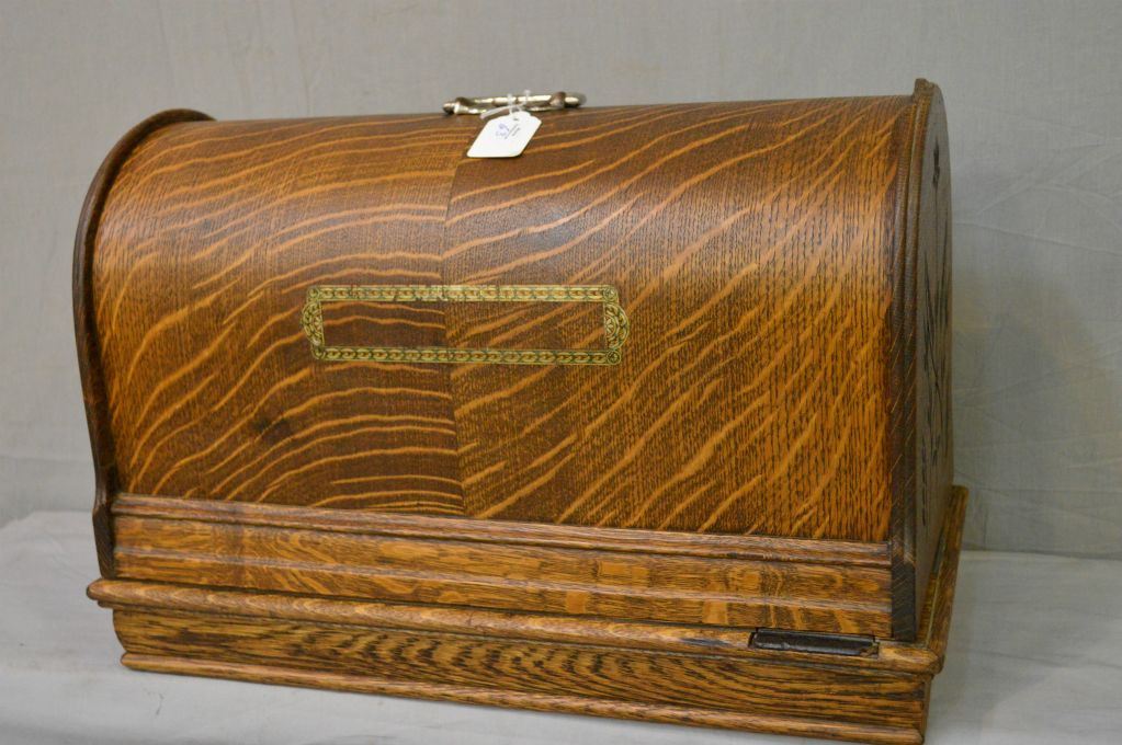 Antique T. Eaton hand crank portable sewing machine with original