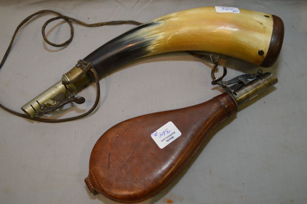 Two antique powder horns including one leather and one horn