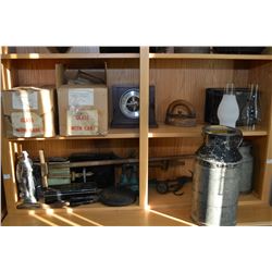 Two shelf lots of collectibles including lamp globes, cream cans, sadiron, battery boxes, scales etc