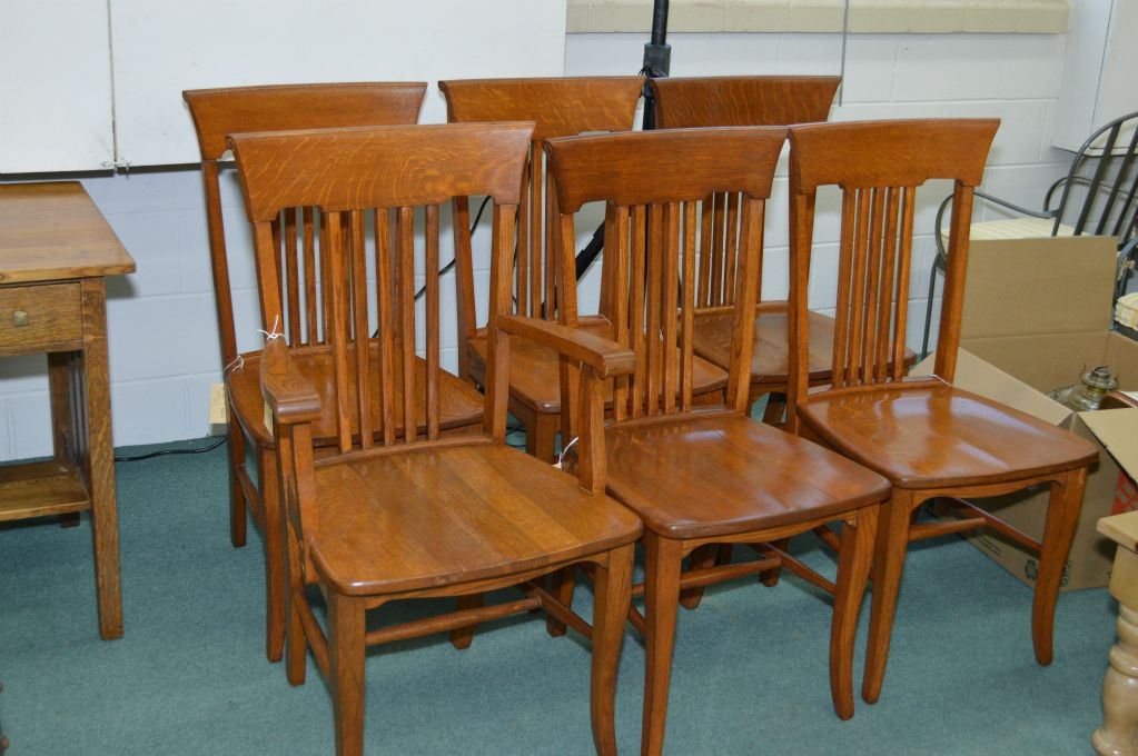Set of six Mission style oak slat back dining chairs including one arm