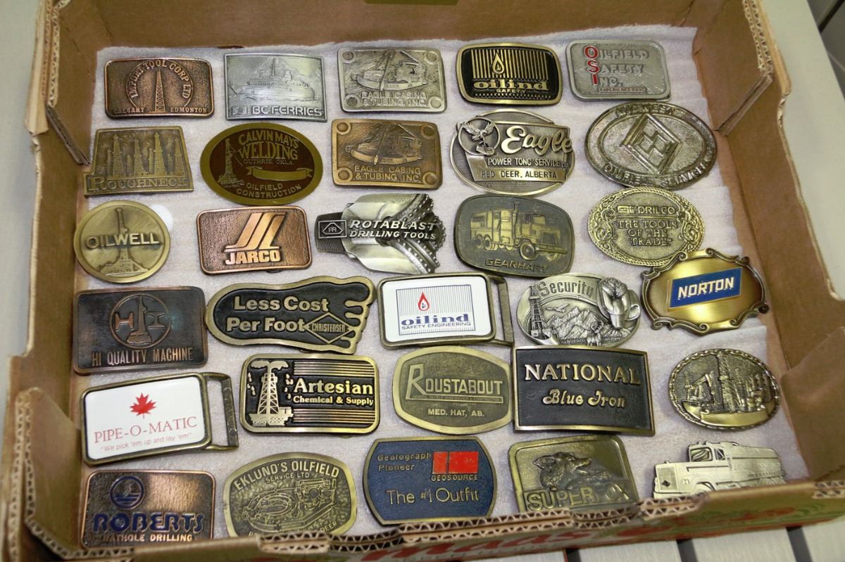 COLLECTION OF 30 VINTAGE OILFIELD BELT BUCKLES