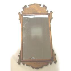 A GEORGIAN WALNUT & MAHOGANY FRAMED WALL MIRROR, the frame surmounted with scrolled pediment 100 -..