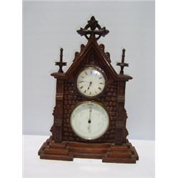 AN OAK MANTEL CLOCK, with white dial & Roman numerals. The dial set above a barometer 50 - 80...