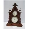 Image 1 : AN OAK MANTEL CLOCK, with white dial & Roman numerals. The dial set above a barometer 50 - 80...