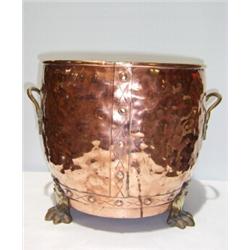 A BEATEN COPPER COAL BUCKET, with brass handles and paw feet 30 - 50...