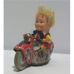 A SCHUCO TIN PLATE CLOCKWORK MOTORBIKE, with rider and key. Mirako Peter 1013 80 - 120...