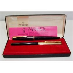 A BOXED PARKER INK PEN, with gold lid and black body, circa 1970's, together with one other Parker..