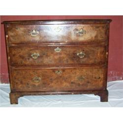 AN EARLY GEORGIAN MAHOGANY & WALNUT CHEST OF DRAWERS, with pierced brass backplate handles & escutc.