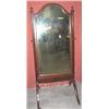 Image 1 : AN EDWARDIAN MAHOGANY CHEVAL MIRROR, on raised arched base, with tapering supports ending with urn..