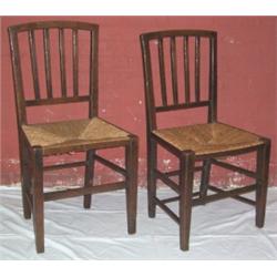 A SET OF FOUR OAK RUSH SEATED CHAIRS, with squared splat backs 400 - 600...