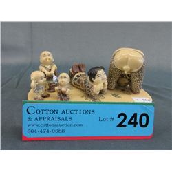 Carved painted oriental figurines