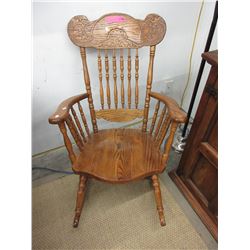Carved back oak rocking chair - used