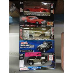 3 Scale model cars in boxes
