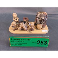 Carved painted oriental figurines