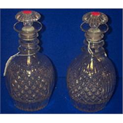 A PAIR OF IRISH STYLE MOULD BLOWN DECANTERS, with triple neck rings and mushroom stoppers each...