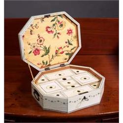 AN ANGLO-INDIAN OCTAGONAL ENGRAVED IVORY WORK BOX, EARLY 19th CENTURY, the interior with lidde...