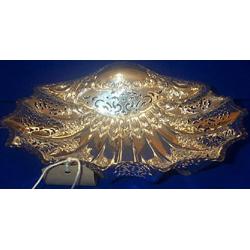 A PIERCED BASKET IN THE FORM OF A SCALLOP SHELL, SHEFFIELD, 1938, on mollusc shaped feet 26cms...