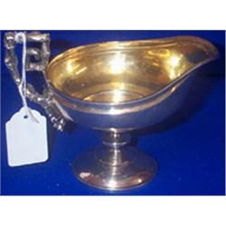 A CREAM JUG, LONDON 1851, with channelled rim and gilt interior, with naturalistic vine leaf h...
