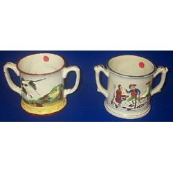 A PAIR OF STAFFORDSHIRE TWO HANDLED MUGS, 19th CENTURY, the interiors with frogs. e150/200...