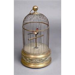 A GILT BRASS BIRD CAGE AUTOMOTOR, CONTINENTAL, 19th CENTURY, the bird with a musical movement...