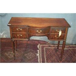A SATINWOOD EBONY LINE INLAID BOWED BREAKFRONT SIDE TABLE, c.1790, central bowed drawers flank...