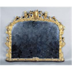 A CARVED AND GILTWOOD OVERMANTLE, MID 19th CENTURY, the plate within a vigorously carved pierc...