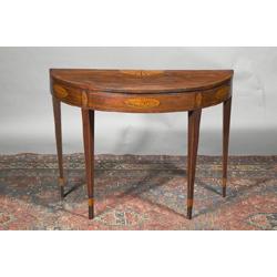 A MAHOGANY ŒD¹ SHAPED FOLD OVER TOPPED CARD TABLE, IRISH, LATE 18th CENTURY, the top centred b...