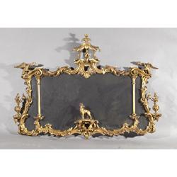A CARVED GILTWOOD OVERMANTLE, c.1900, IN GEORGIAN STYLE, the rectangular compartmented plate i...