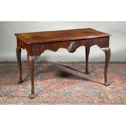 A MAHOGANY SIDE TABLE, IRISH, 18th CENTURY, with moulded rectangular top, the shaped apron cen...