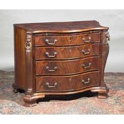 A MAHOGANY CROSSBANDED SERPENTINE CHEST, BASICALLY 18th CENTURY, with moulded rim, above a sli...