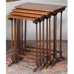 A NEST OF FOUR MAHOGANY AND SATINWOOD INLAID QUARTETTO TABLES, IN GEORGIAN STYLE, on spindle s...