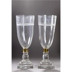 A SET OF FOUR GLASS CANDLE HOLDERS, CONTINENTAL, EARLY 20th CENTURY, the urn shaped bowls cut...